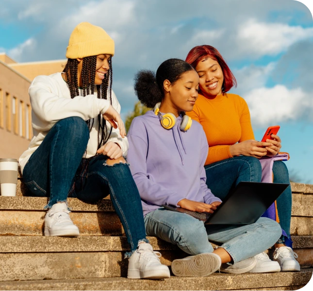 Friends sitting on outdoor steps together – online psychiatry in Grand Rapids, MI